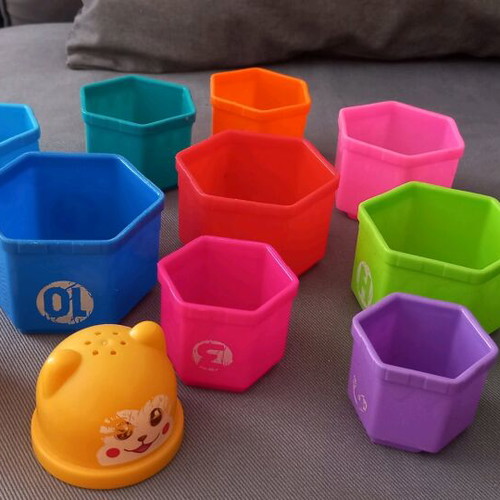 Activity toy pyramid with cups used