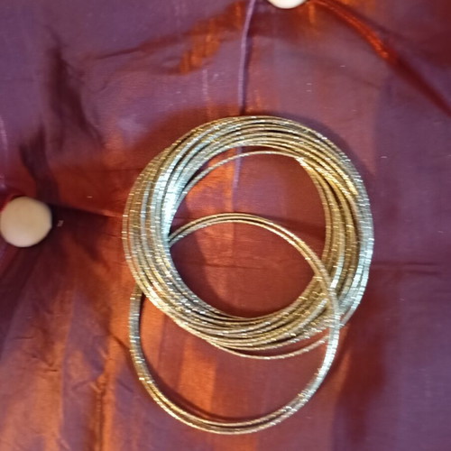 Bracelet made of 32 thin metal pieces like new, gold tone