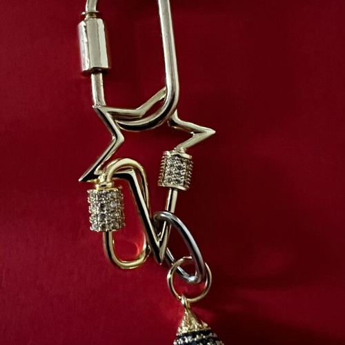 Long pendant with silver chain and gold rings, star and diamond-shaped drop