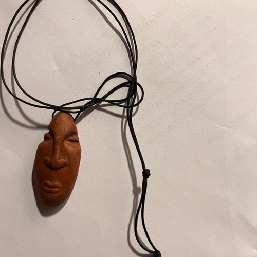 Clay face necklace like new, beige