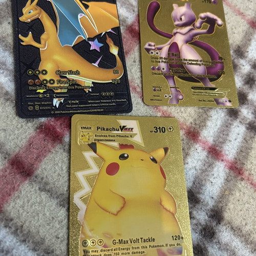 Pokemon cards Charizard V, Mewtwo EX, Pikachu VMAX