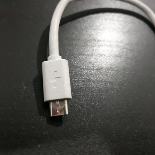 USB charger cable used, white color