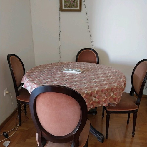 Wood-carved round table with 4 chairs like new