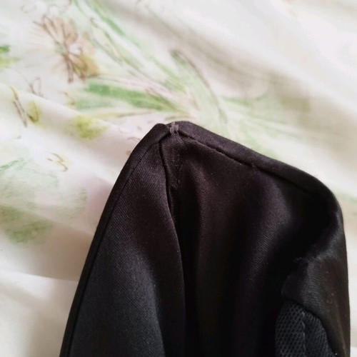 Black corset used with pointed neckline and leather look, size XS