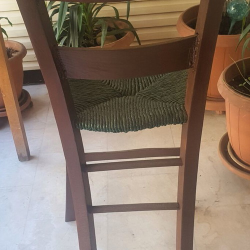 Wooden high chair with woven seat