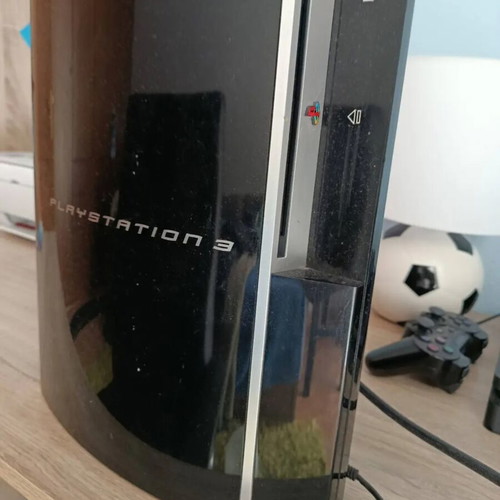 PlayStation 3 console used with controller, charging cable and 6 games