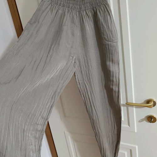 Strapless jumpsuit used, gray brown with bow and ruffles