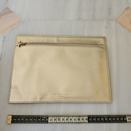 Givenchy pouch like new, gold