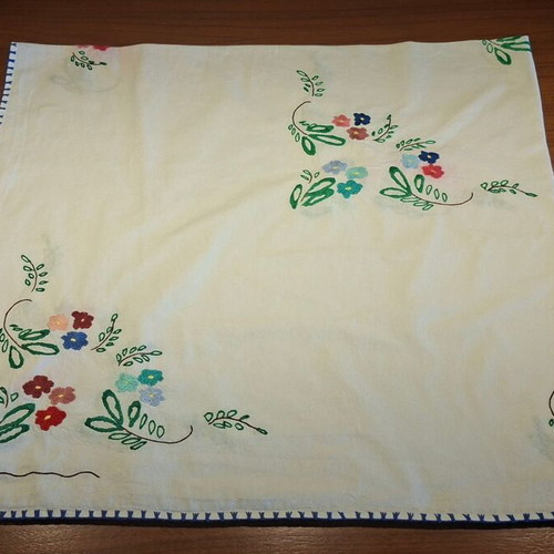 Vintage handmade embroidered tablecloth with flowers and needlework