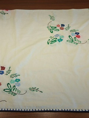 Vintage handmade embroidered tablecloth with flowers and needlework