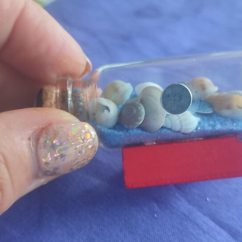 Souvenir from Santorini glass bottle with shells, sand and evil eye magnet like new