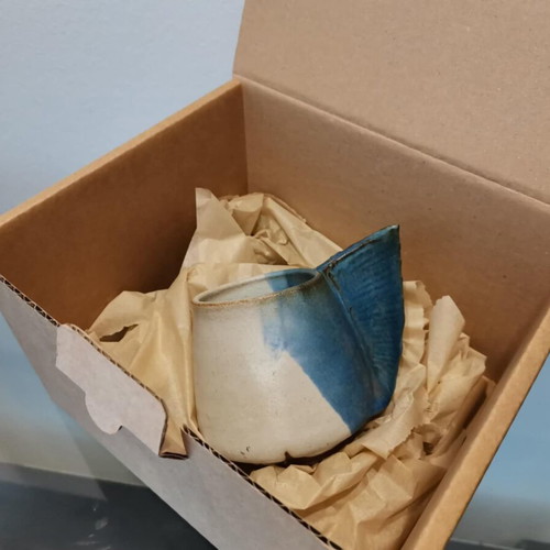 Clay handmade mug used with wavy handle