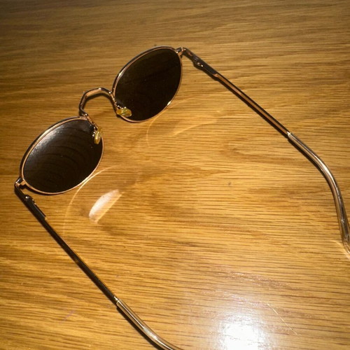 Sunglasses used, black and gold