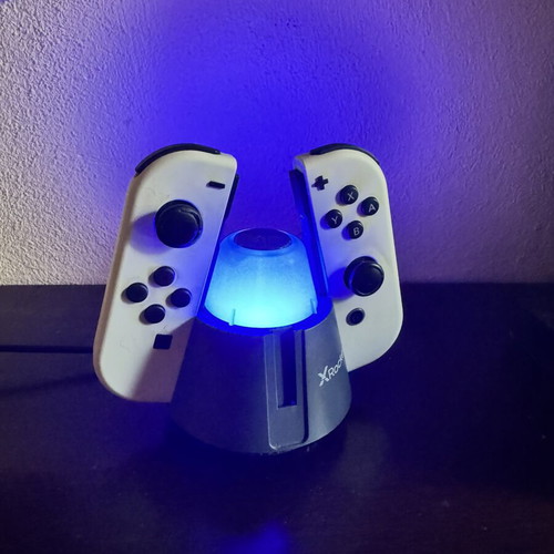 Nintendo Switch OLED console used with 3 games and Zelda cases