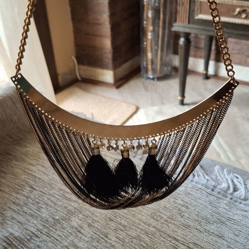 Gold necklace like new with black and gold chains and tassels