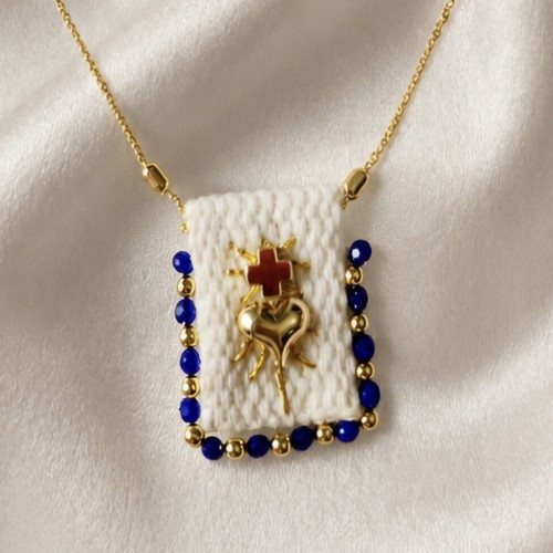 Steel necklace new, gold tone with blue beads and handmade motif