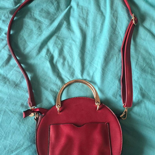 Round red shoulder bag
