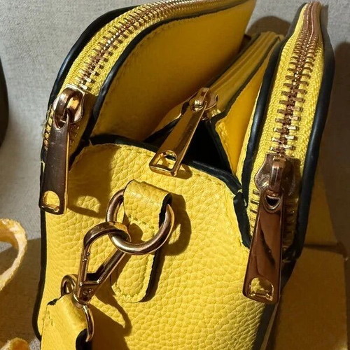 Yellow shoulder bag like new with strap and silver details