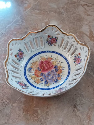 Porcelain bowl used for sweets with gold border and floral design