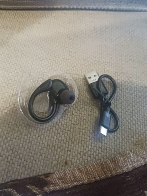 Earbud with behind-ear support and charging cable new