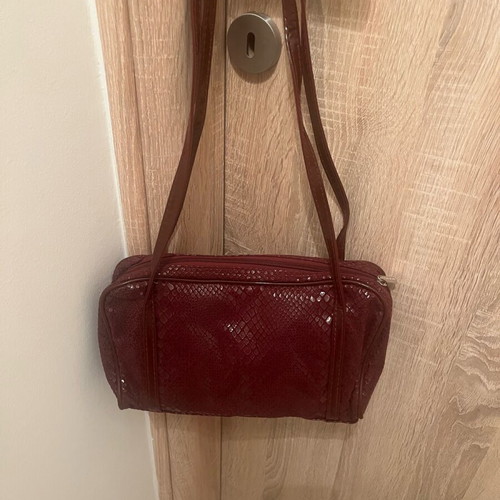 Fabric bag in burgundy color like new for formal occasions
