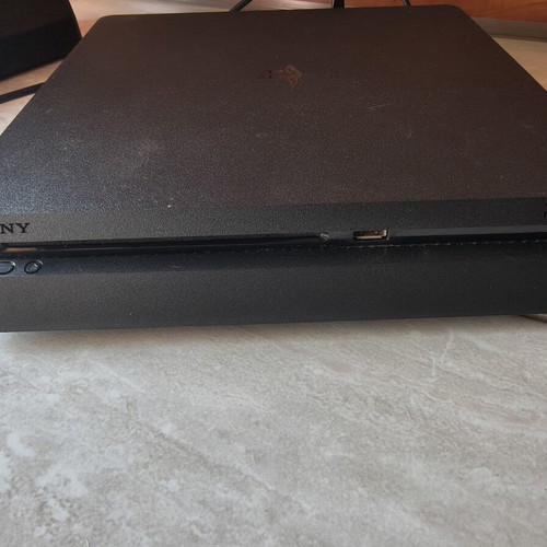 PS4 Slim 1TB console used with 3 games and 1 controller