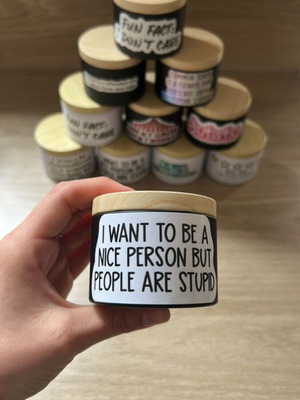 Scented candle with powder aroma and witty label, new