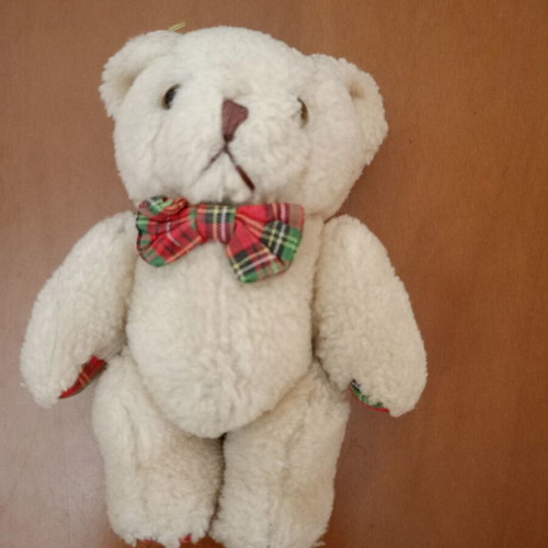 Plush teddy bear with plaid bow tie like new