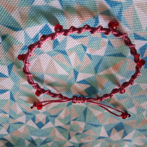 Macrame bracelet with decorative red beads, like new