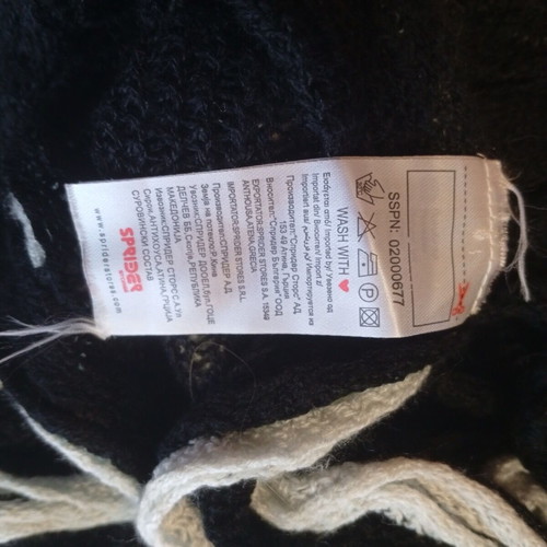 Set of 2 knitted Sprider scarves like new, black and white and orange with pom-poms