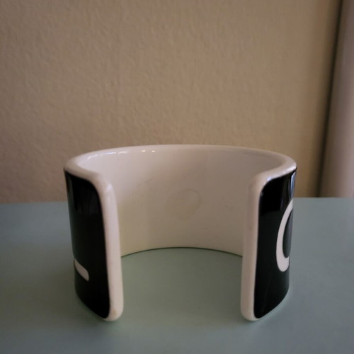 Cuff bracelet like new, black resin with white letters