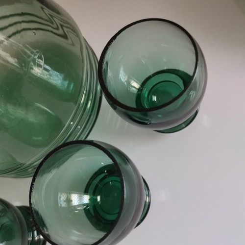 Vintage decanter set with 5 green glass shot glasses used