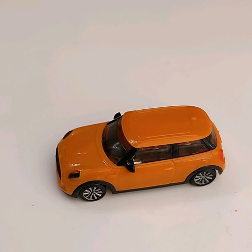 Toy car used, orange plastic, 4 cm miniature