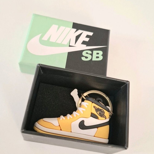 Nike keychain new, yellow and black in box