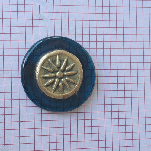 Paperweight with Vergina Star used, brass on glass base