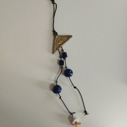 Hanging wall eye charm used with bronze eye