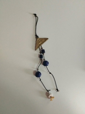 Hanging wall eye charm used with bronze eye