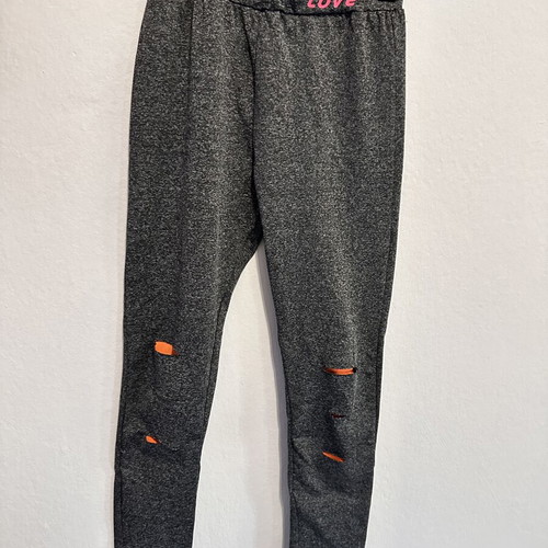 Girls' sports set with grey leggings and orange tank top, size 10