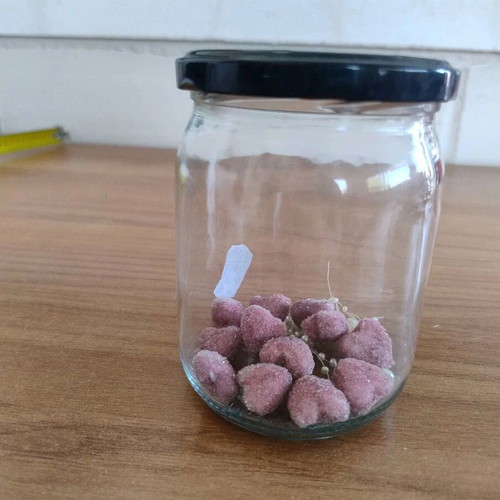 Glass storage jar with decorative stones like new