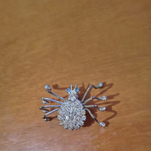 Vintage spider brooch with blue eyes like new