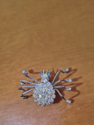Vintage spider brooch with blue eyes like new