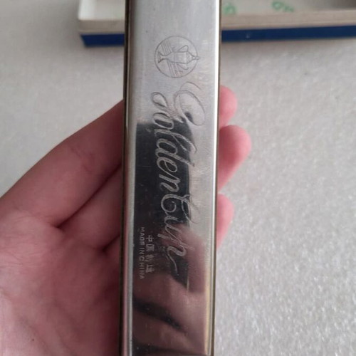Harmonica vintage used in its box