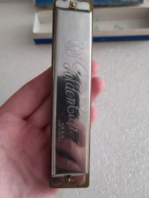 Harmonica vintage used in its box