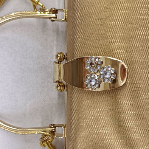 Gold evening handbag like new with missing rhinestone