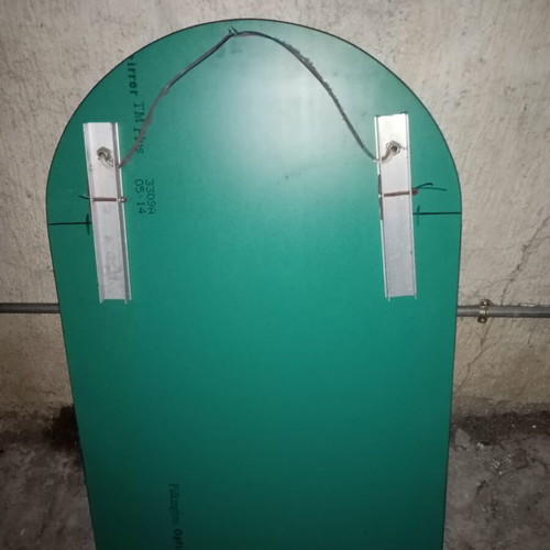 Semi-circular bathroom mirror used with 2 lights and shelf