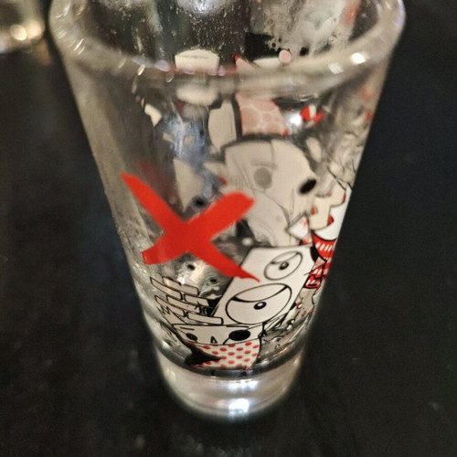 Set of 10 thematic collectible vodka shot glasses 30ml like new