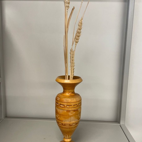 Wooden vase made of beech with traditional carved geometric patterns