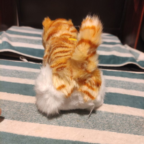 Interactive plush cat with yellow collar, like new