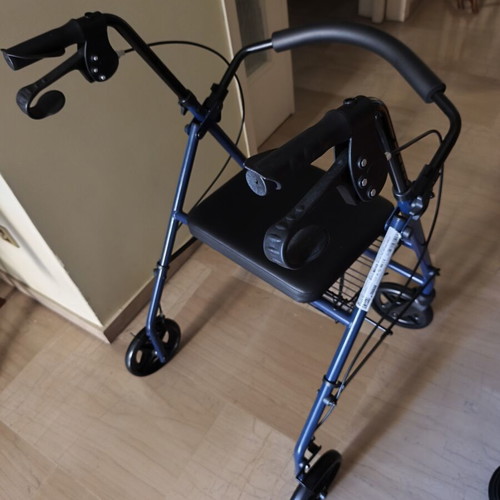 Walker with brakes and seat new