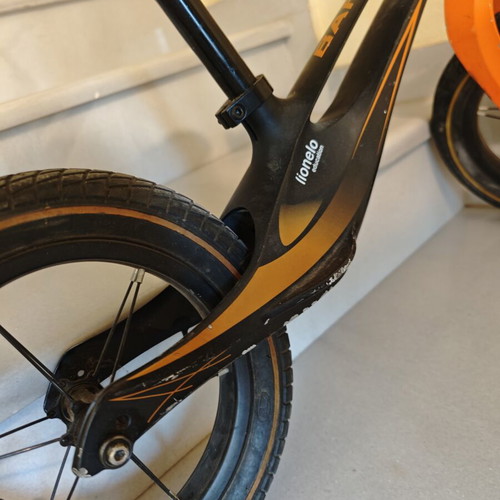 Lionelo Bart Air balance bike used, black orange